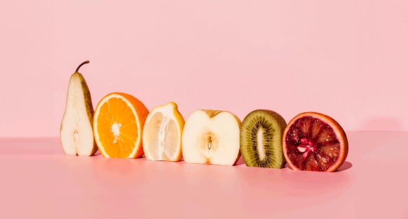 Sample post: sliced fruit in a row on pink.