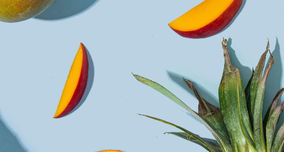 Sample post: mango and pineapple on blue.